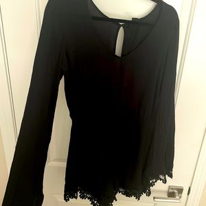 Black romper w/ lace details and bell style sleeve